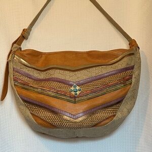 Vintage Sharif leather and woven crossbody bag with a boho-southwestern design.